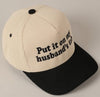 Put it on my Husbands Tab Trucker Hat
